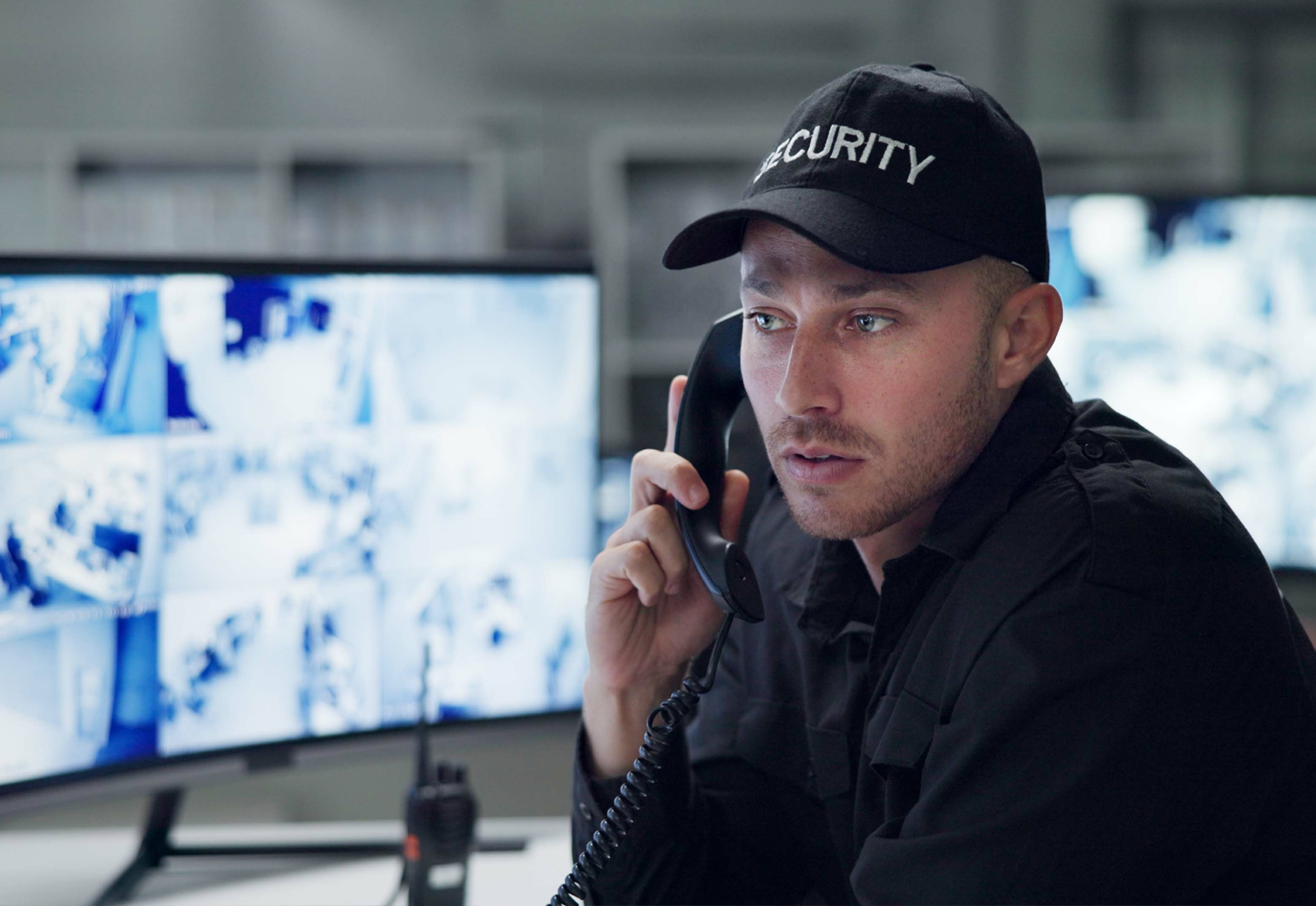 Parking security guard answering emergency calls from Aiphone intercom systems